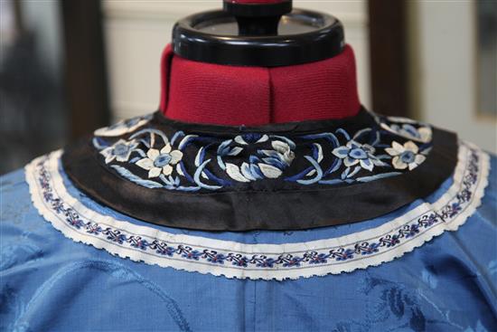 A Chinese blue silk, damask and embroidered ladys robe, late 19th / early 20th century,